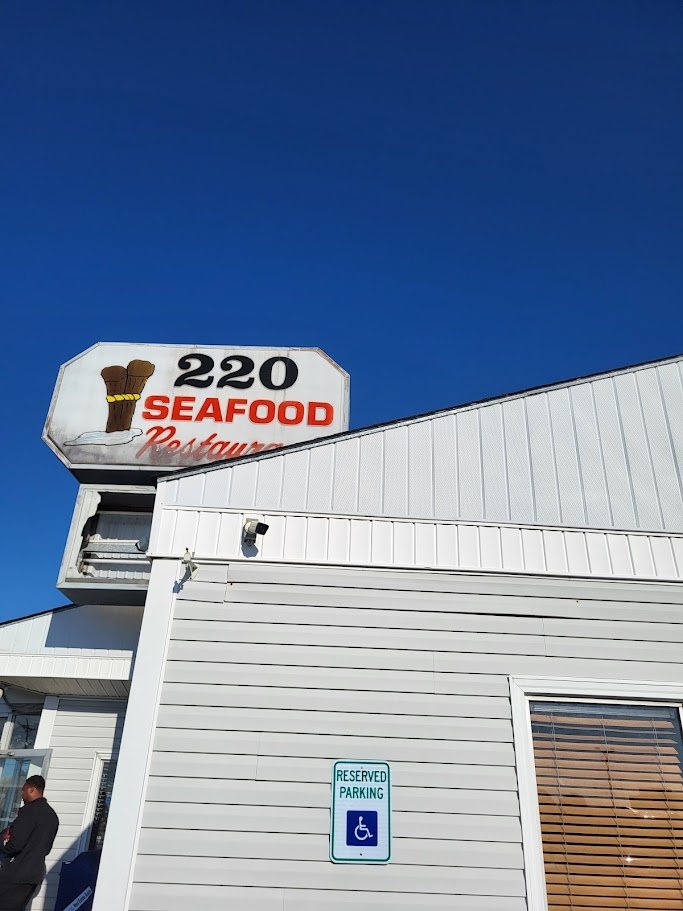 A hearty seafood dinner with sides and lemon.