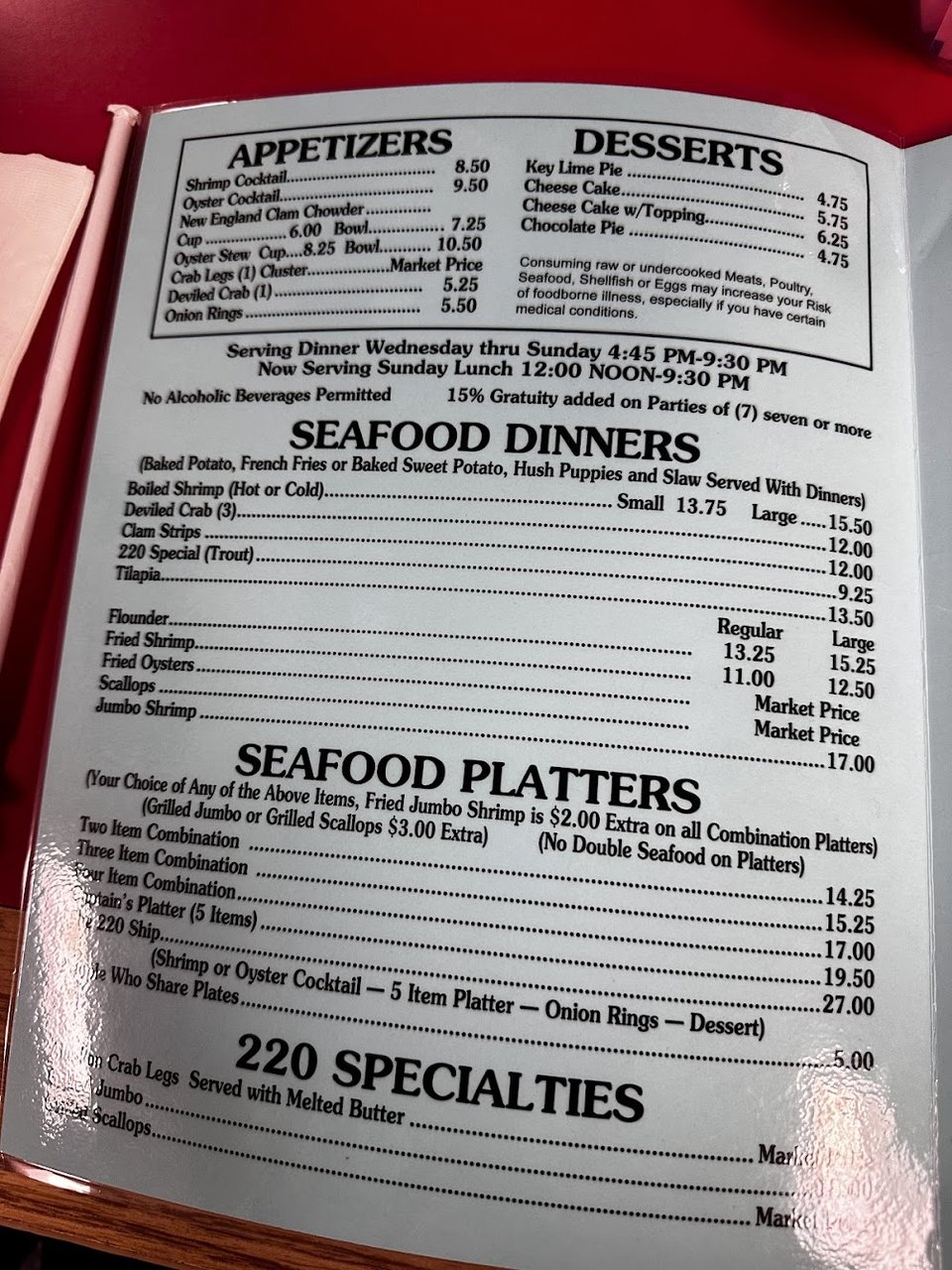 A menu-style spread of fried fish dishes.